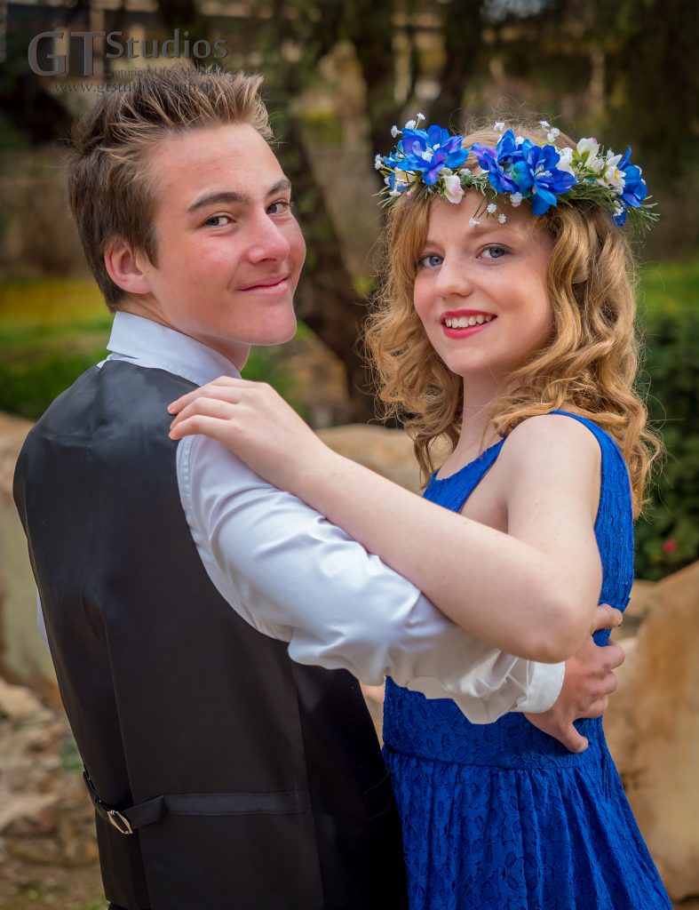 Mikayla and Marcus. Blue dress and blue floral crown.