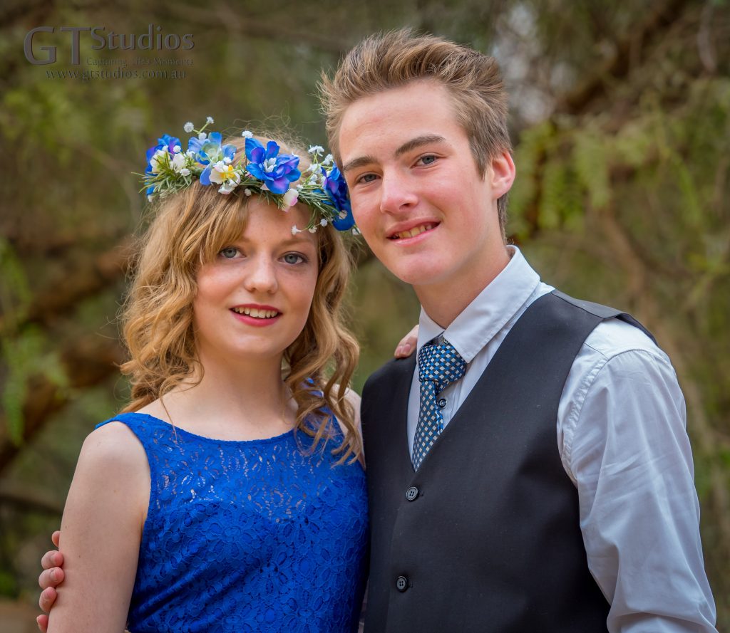 Mikayla and Marcus. Blue dress and blue floral crown.