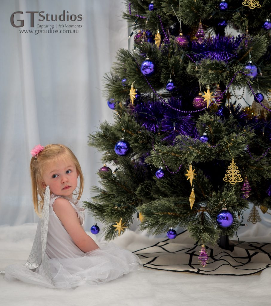 Pretty girl and Christmas tree